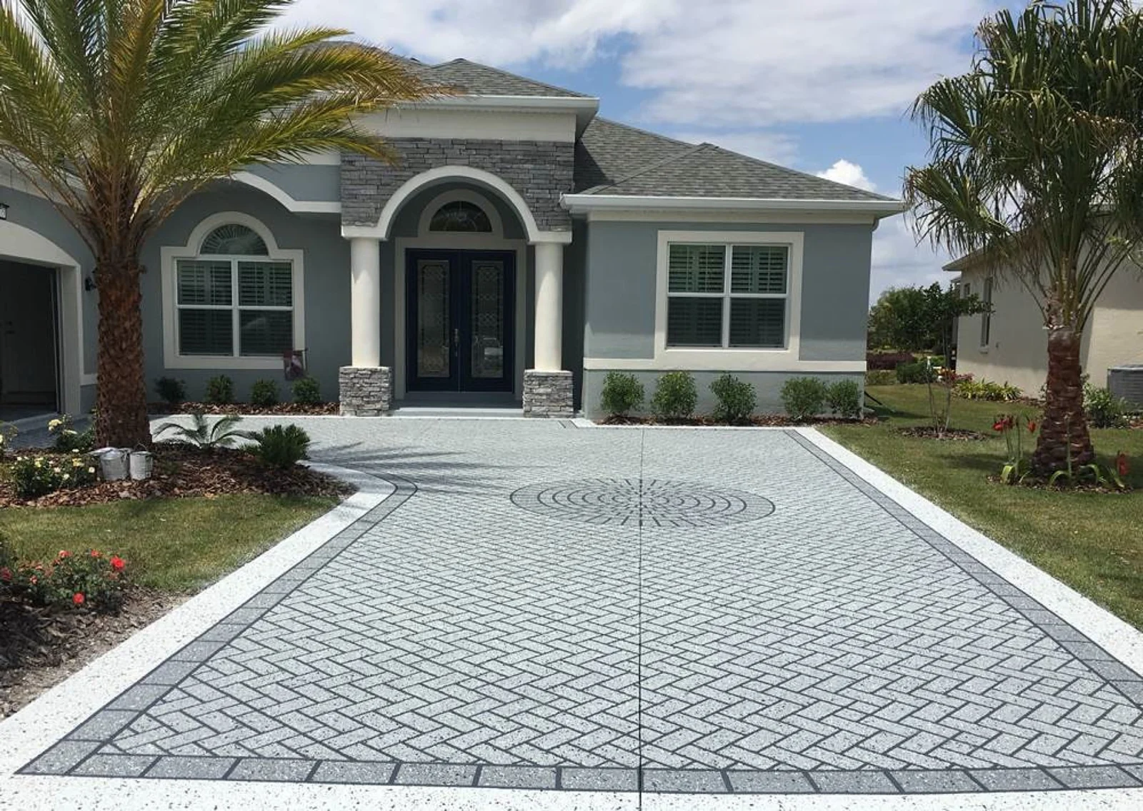 Finished concrete driveway at a mountain home by Ironstone Concrete & Design